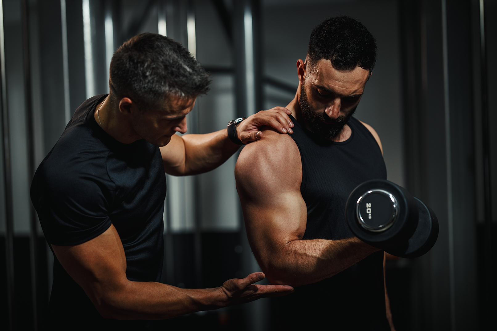 Certified Personal Trainer Assisting with Proper Form